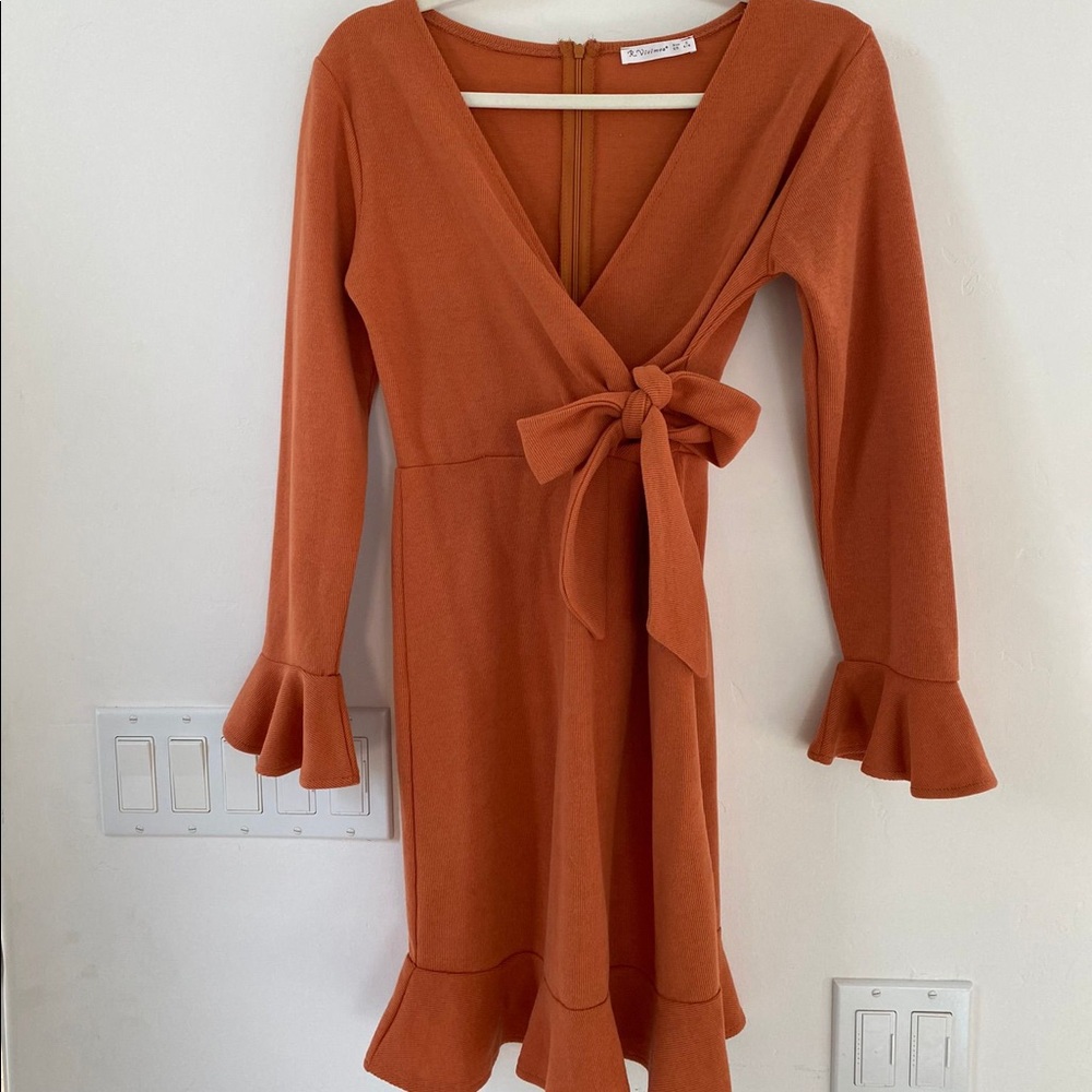 Woman’s orange dress